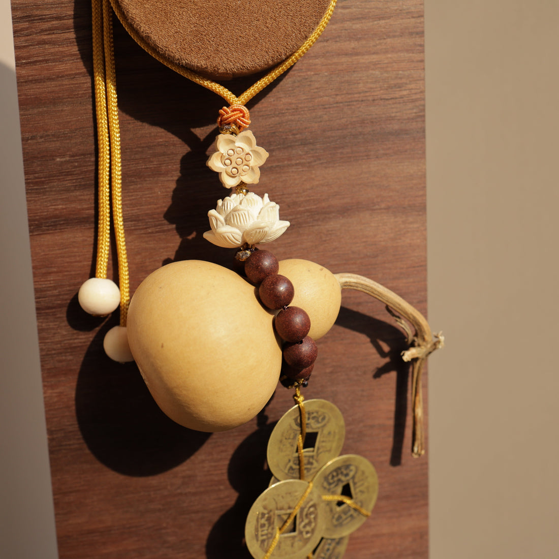 Naturally grown Wu Lou gourd car charm with Five Emperor Coins, handcrafted pet-safe car accessory representing protection and prosperity